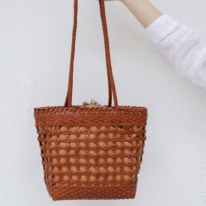 Cowhide handmade hollow woven bag